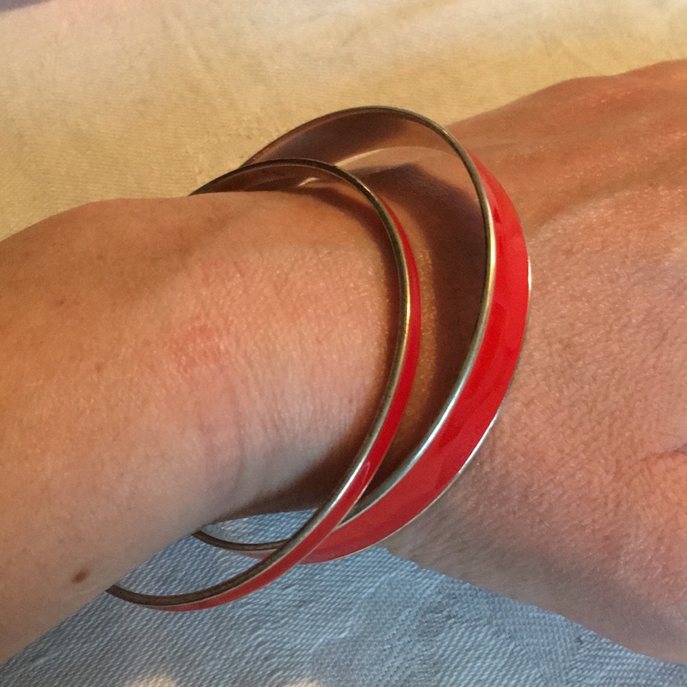Two mixed size bracelets-red and silver tones